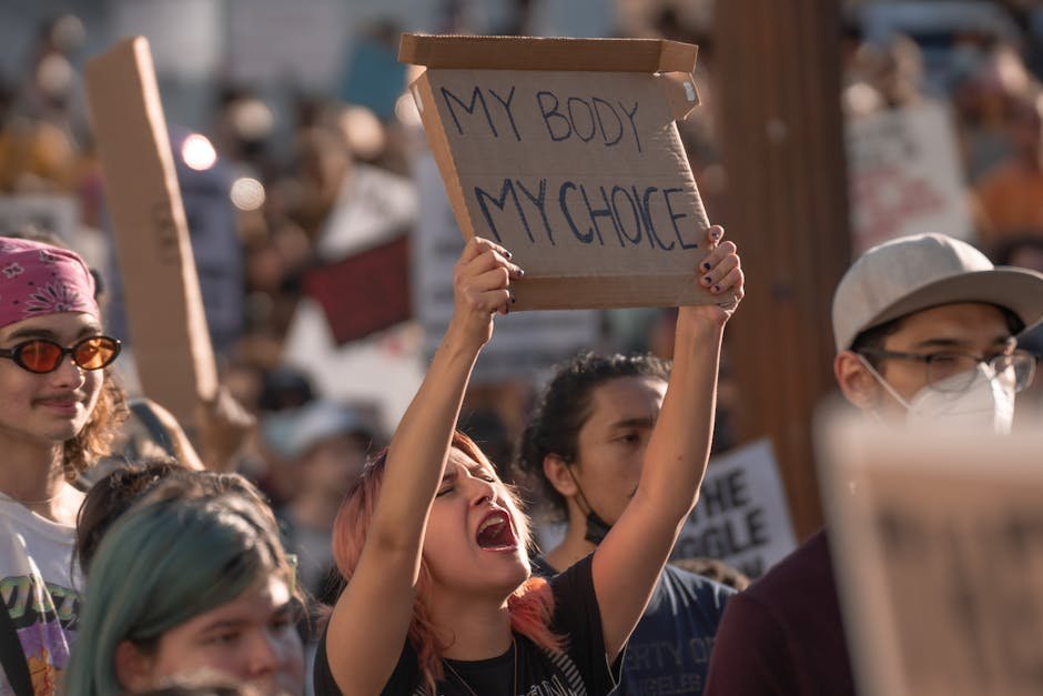 Pro-choice activists holding signs during a protest in Los Angeles advocating for women's rights.